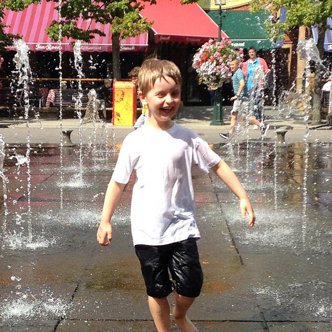 Boy soaking wet after ride